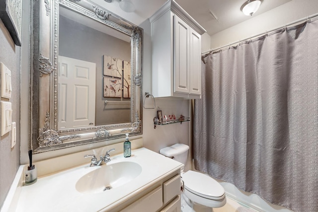 full bathroom with toilet, vanity, and shower / bath combination with curtain