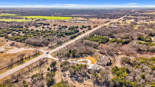 birds eye view of property with a rural view