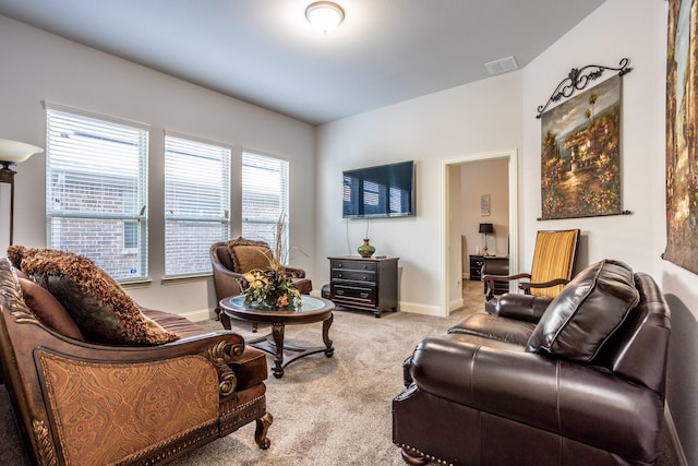 living room with light colored carpet and plenty of natural light