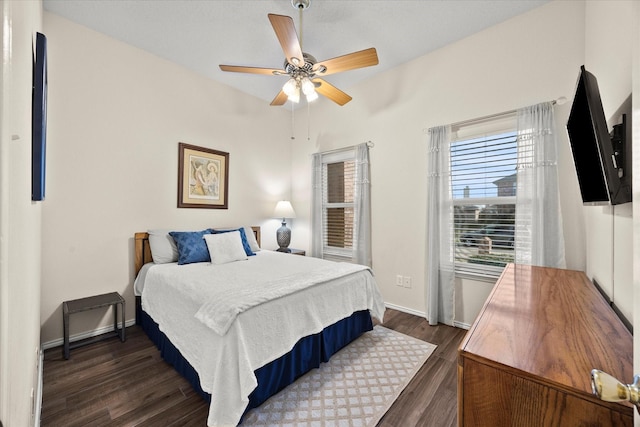 bedroom featuring ceiling fan and dark hardwood / wood-style flooring