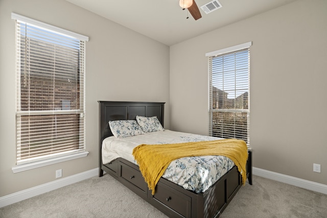 carpeted bedroom with ceiling fan