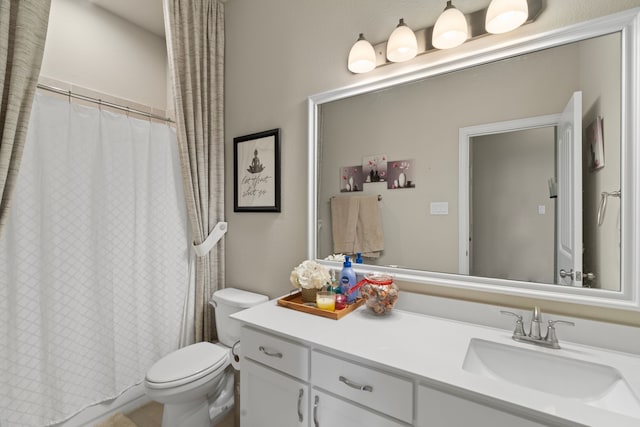 bathroom with toilet and vanity