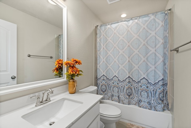 full bathroom featuring toilet, shower / bath combo, and vanity