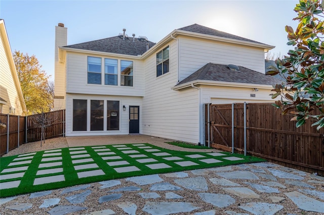 rear view of property featuring a patio