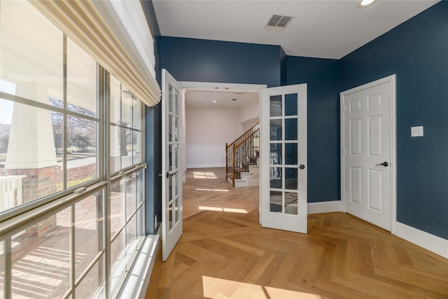 interior space featuring parquet flooring and french doors