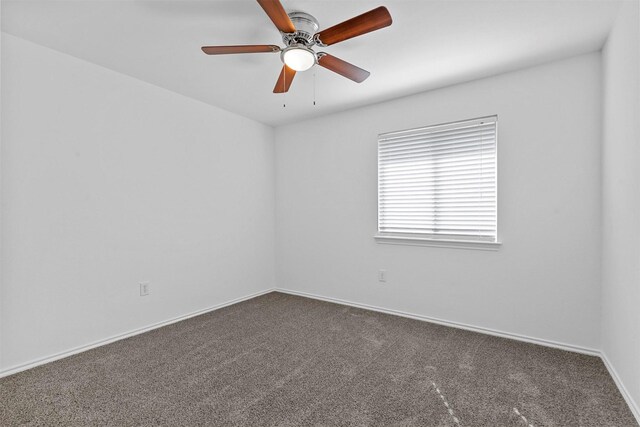 empty room with a textured ceiling, carpet floors, and ceiling fan