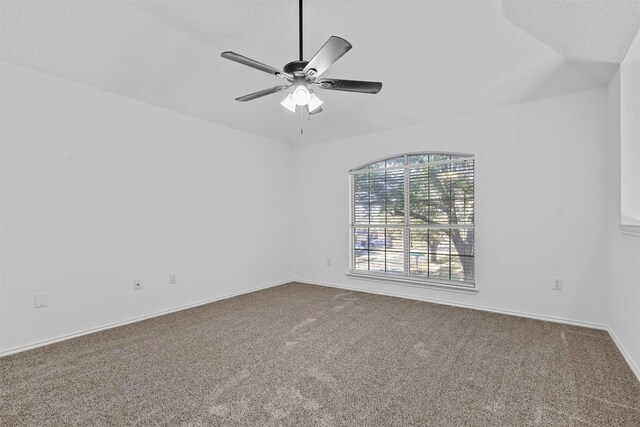 unfurnished room with a textured ceiling, vaulted ceiling, ceiling fan, and carpet flooring