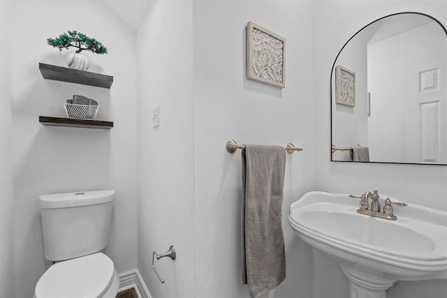 bathroom featuring sink and toilet