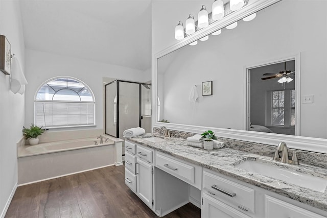 bathroom with vanity, separate shower and tub, and wood-type flooring