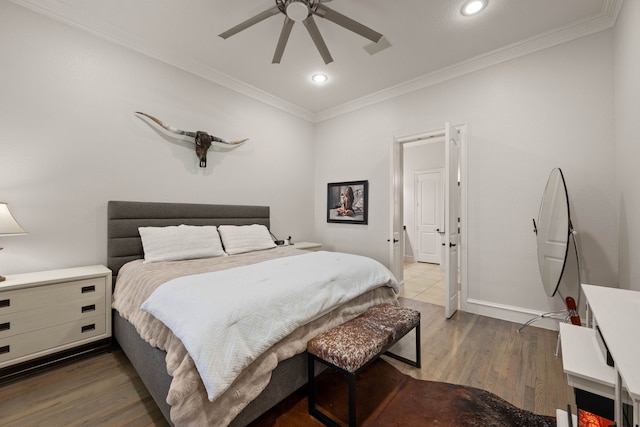 bedroom featuring ceiling fan, dark wood-type flooring, and crown molding