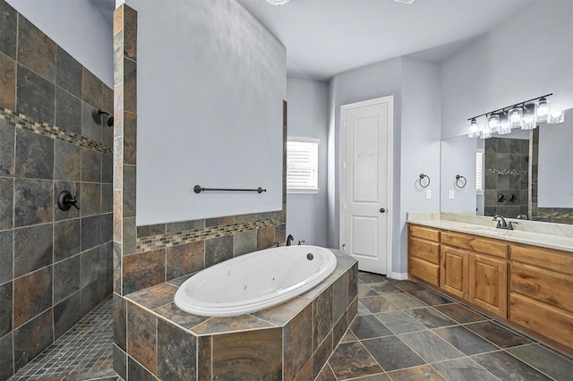 bathroom featuring independent shower and bath and vanity