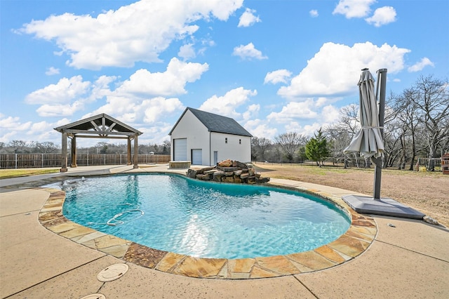 view of pool with a patio area, a gazebo, and an outdoor structure