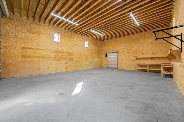 garage featuring wood walls