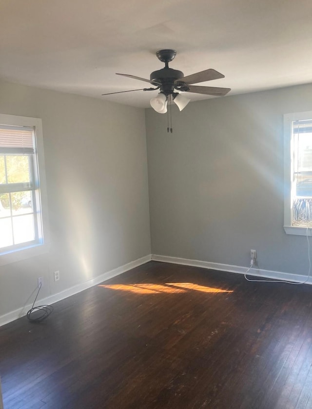 unfurnished room with ceiling fan and dark hardwood / wood-style floors