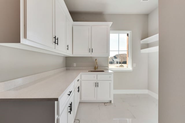 kitchen with sink and white cabinets