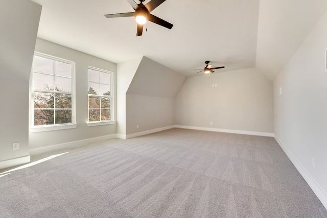 additional living space featuring lofted ceiling, ceiling fan, and light carpet