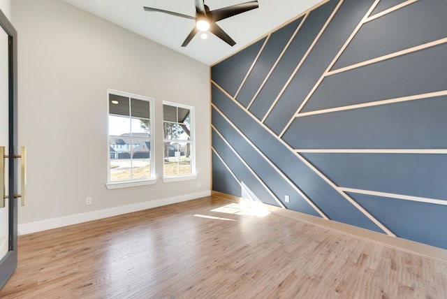 unfurnished room featuring hardwood / wood-style flooring and ceiling fan