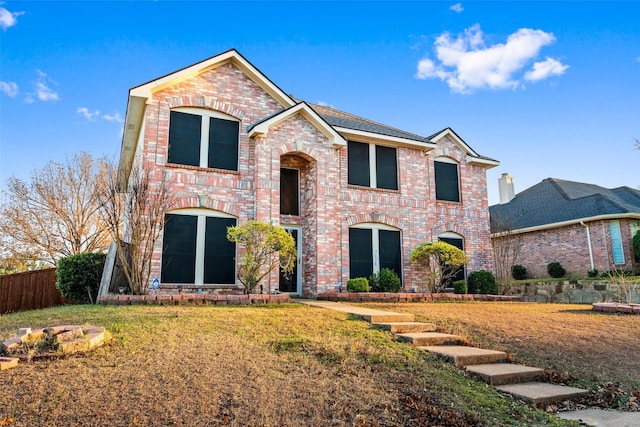 view of front property with a front lawn