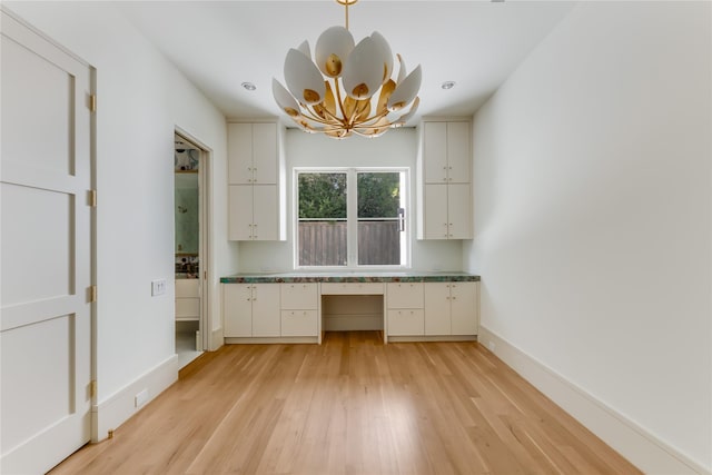 unfurnished office with light wood-type flooring