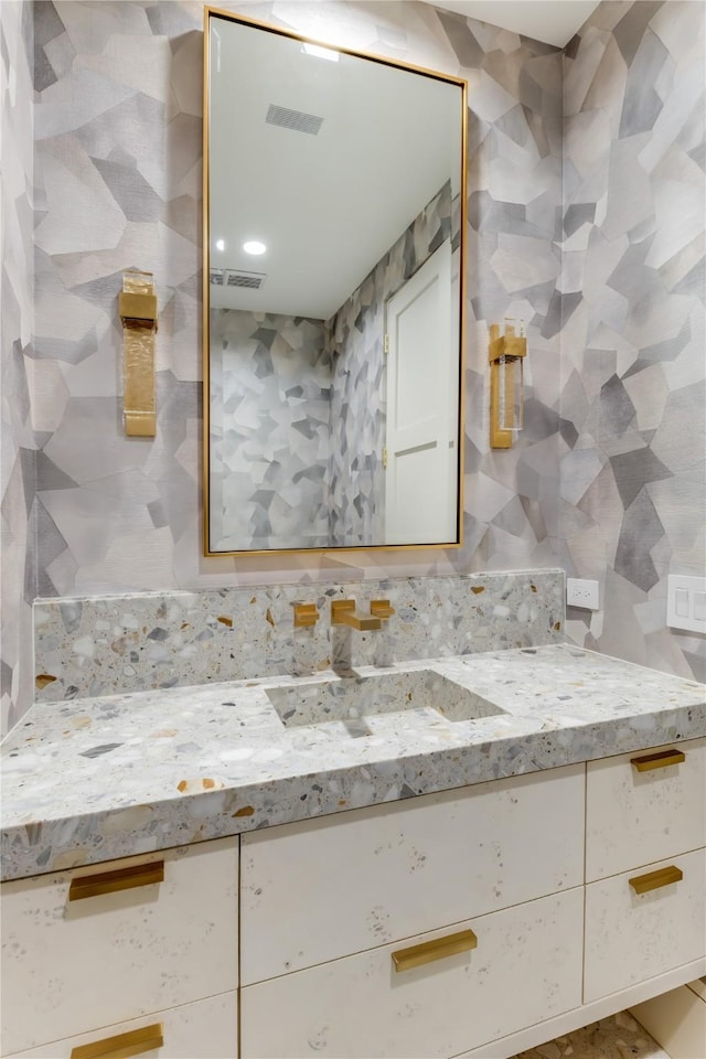 bathroom with tile walls and vanity