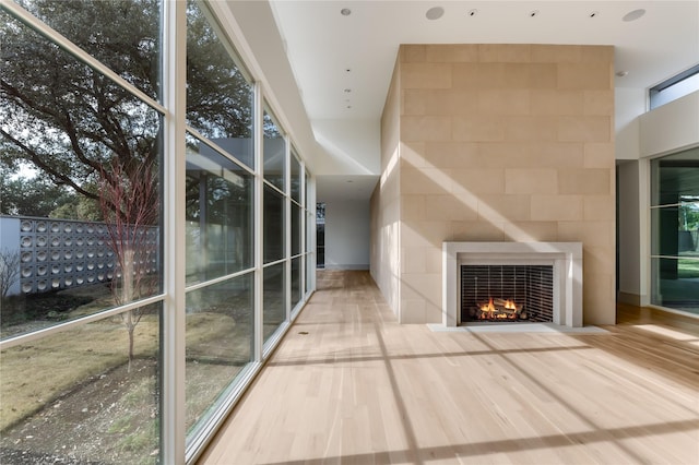 corridor with hardwood / wood-style floors