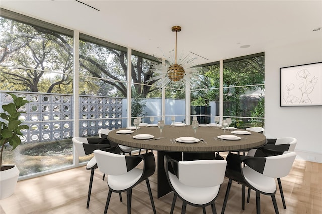 sunroom with a notable chandelier and a wealth of natural light