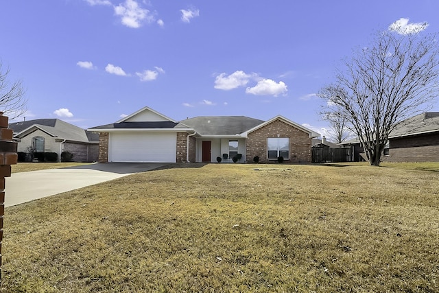 ranch-style house with a front yard and a garage