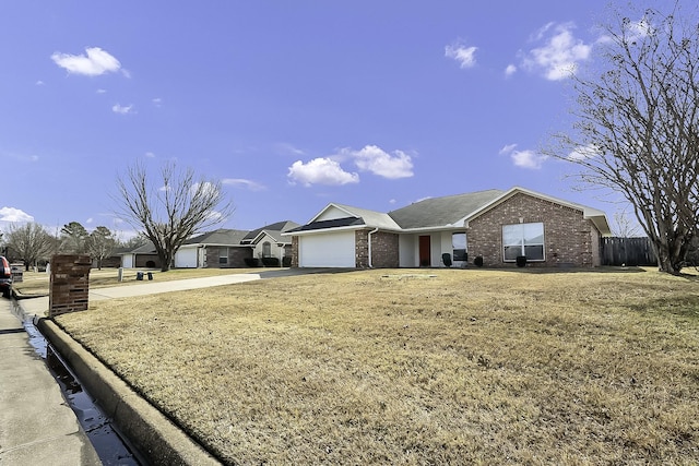 ranch-style house with a front yard and a garage