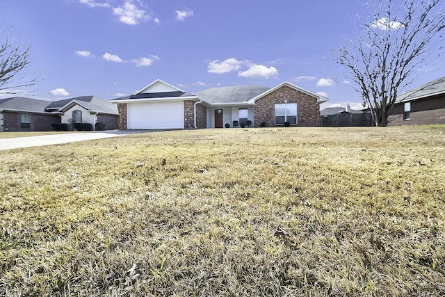 single story home with a front yard and a garage