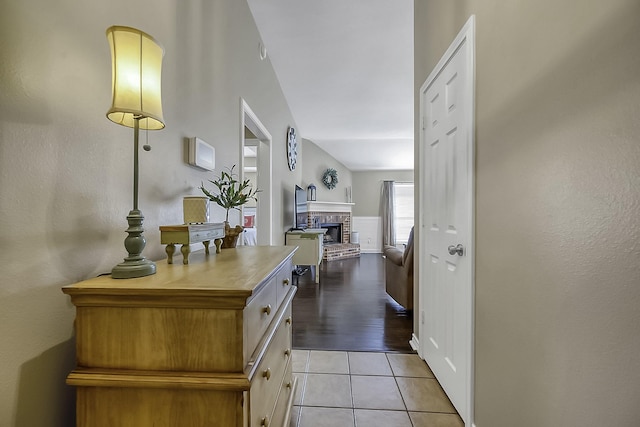 hall featuring light tile patterned flooring