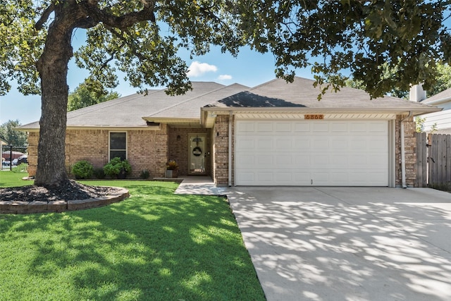 ranch-style home with a front yard and a garage