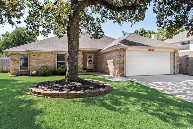 ranch-style home with a front yard and a garage