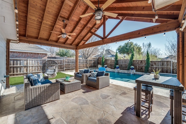 view of patio / terrace featuring a gazebo, ceiling fan, and outdoor lounge area