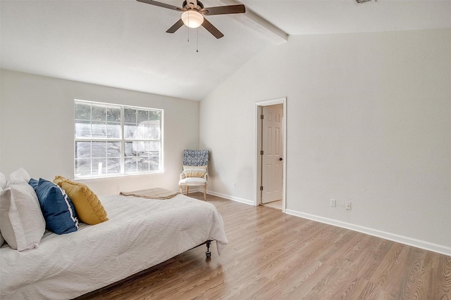 bedroom with ceiling fan, light hardwood / wood-style flooring, and vaulted ceiling with beams