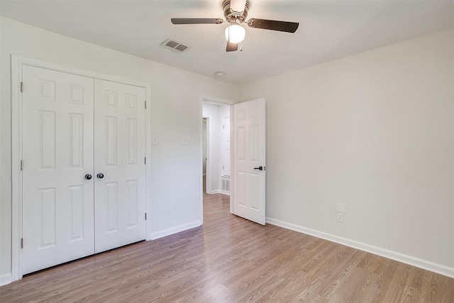 unfurnished bedroom with a closet, ceiling fan, and light hardwood / wood-style flooring