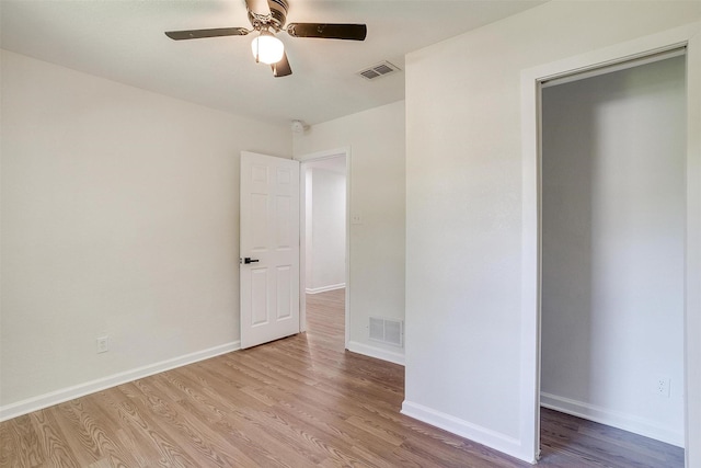 unfurnished bedroom featuring ceiling fan and light hardwood / wood-style floors