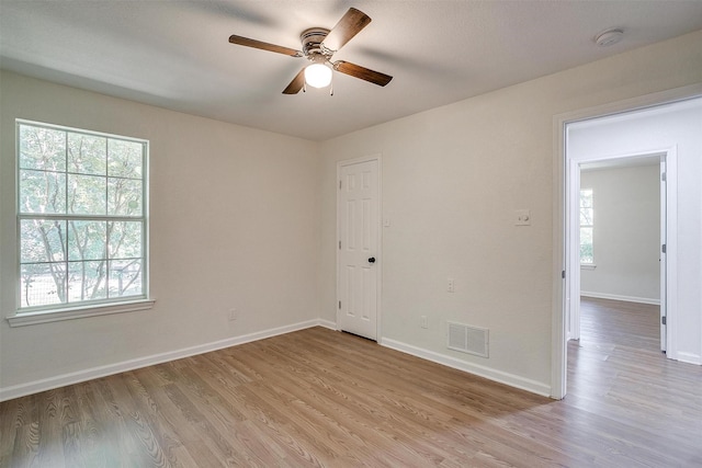 unfurnished room with light hardwood / wood-style floors and ceiling fan