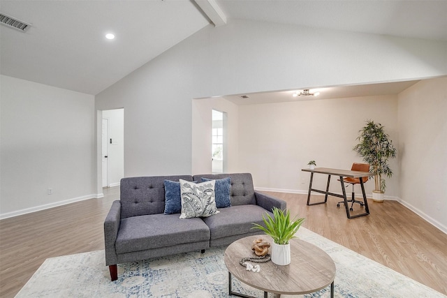 living room with high vaulted ceiling, beam ceiling, and hardwood / wood-style floors