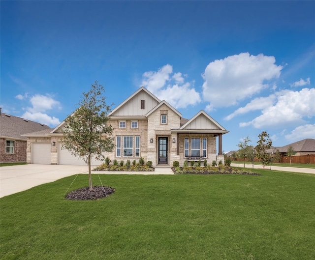 craftsman-style home with a front yard and a garage