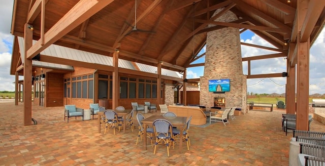 exterior space featuring a gazebo and an outdoor stone fireplace