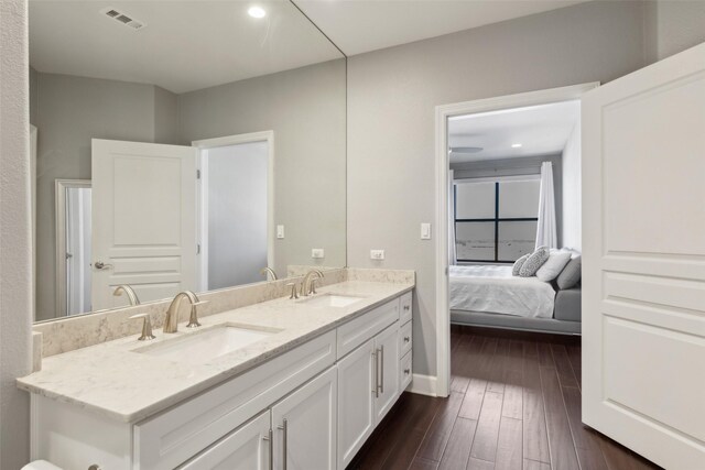 bedroom with ceiling fan and dark hardwood / wood-style floors