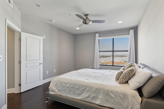 bedroom featuring ceiling fan and dark hardwood / wood-style floors