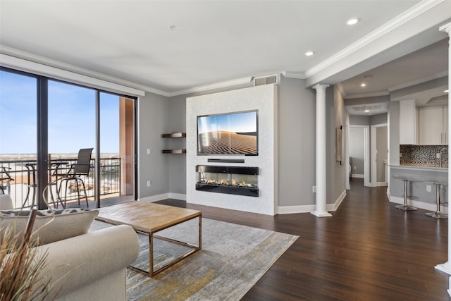 living room with ornamental molding and dark wood-type flooring