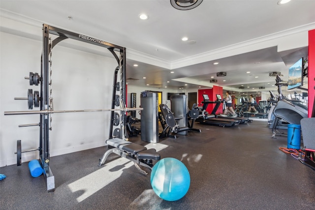 workout area featuring ornamental molding