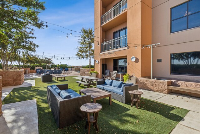 view of patio / terrace with a fenced in pool, a gazebo, and an outdoor living space