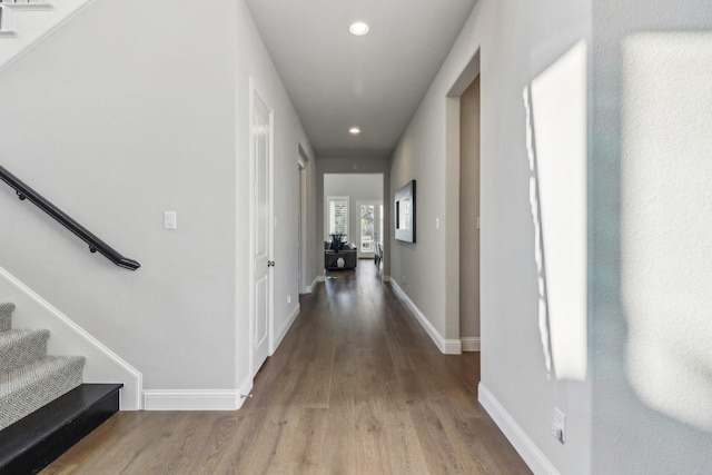 corridor with wood-type flooring