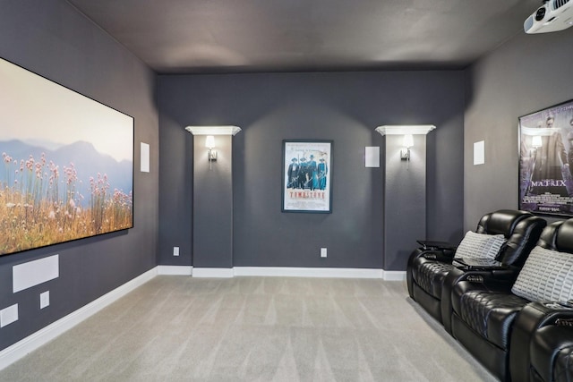 home theater featuring carpet floors and baseboards