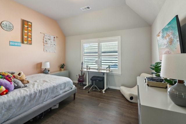 bedroom with dark wood-type flooring, visible vents, vaulted ceiling, and baseboards