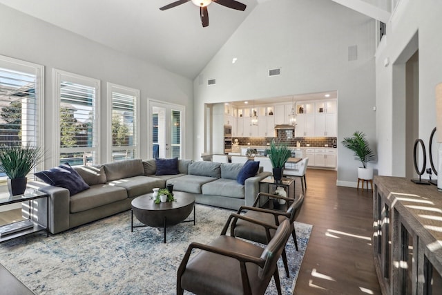 living room with high vaulted ceiling, dark hardwood / wood-style flooring, and ceiling fan