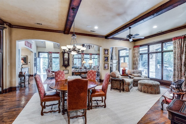 dining room featuring beam ceiling, a wealth of natural light, and dark wood-type flooring